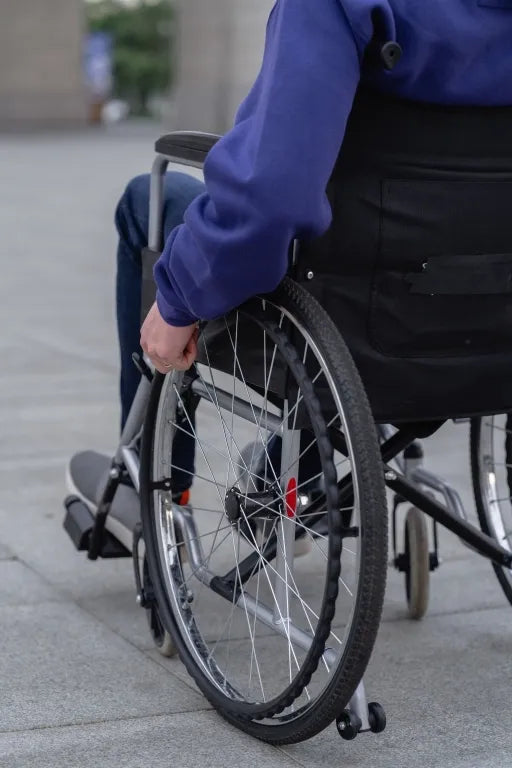 Active wheelchair user navigating independently outdoors